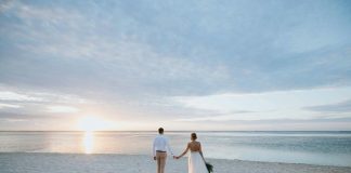 Beach Weddings in the Florida Panhandle (West End) White Sands & Open Spaces man and woman walking on beach during daytime